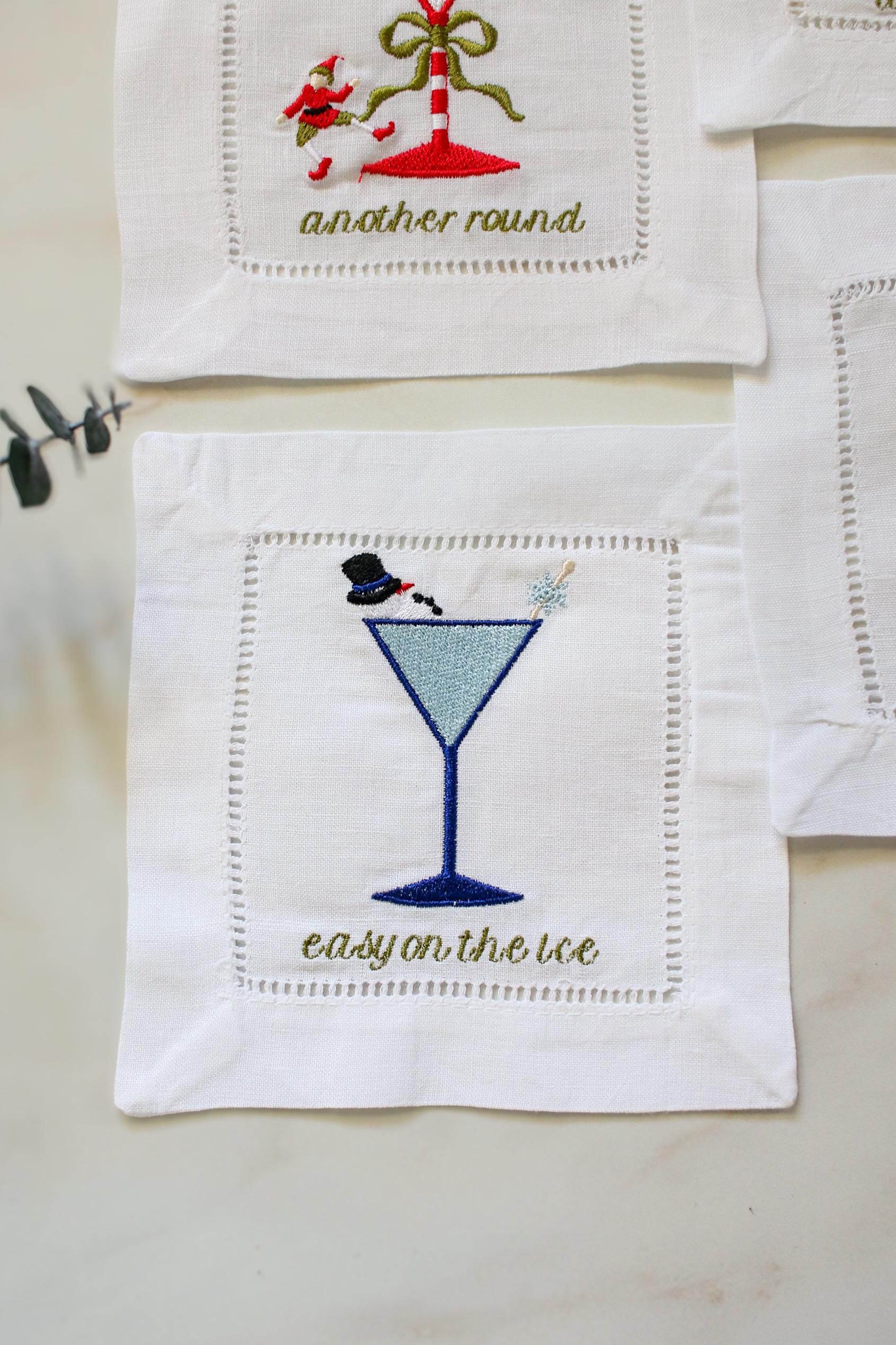 Snowman holiday cocktail napkin – embroidered martini glass with snowman and snowflake stir stick, easy on the ice.